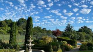A garden with clouds above it in Bevere in Worcester