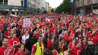 The marchers filled the street in front of Belfast City Hall