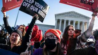 Pro-life and pro-choice protestors gather outside the Supreme Court as arguments begin about the Texas abortion law by the court on Capitol Hill
