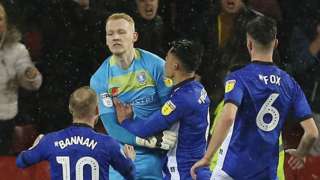 Sheff Wed celebrate Cameron Dawson's penalty save