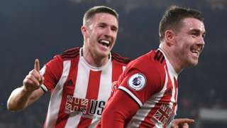 John Lundstram and John Fleck celebrate with Sheffield United
