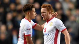 marcus tavernier and dean lewington of mk dons