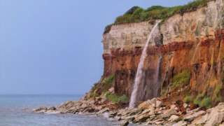 The water coming off the clifftops in Hunstanton, like a waterfall