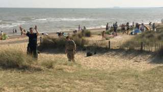 Police and bomb disposal experts on Walberswick beach