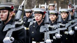 Servicewomen at remembrance service