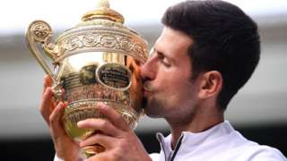 Novak Djokovic celebrates winning the Wimbledon men's singles title