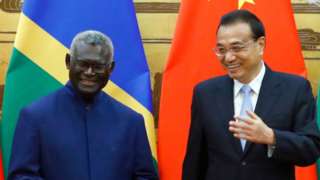 Solomon Islands Prime Minister Manasseh Sogavare and Chinese Premier Li Keqiang attend a signing ceremony at the Great Hall of the People on October 9, 2019 in Beijing, China.