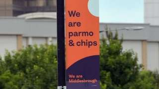 A banner saying 'we are parmo and chips'