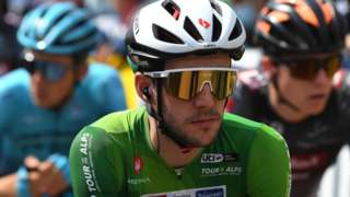 Britain's Simon Yates wearing the green leader's jersey at the 2021 Tour of the Alps