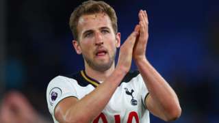 Harry Kane applauds fans after the game