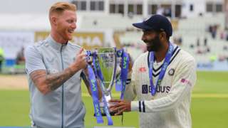 Ben Stokes (left) and Jasprit Bumrah (right) hold up the trophy after the England-India Test series is drawn 2-2