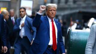 Former US President Donald Trump departs after speaking to the press after attending the civil fraud trial against the Trump Organization in New York State Supreme Court, in New York City on January 11, 2024