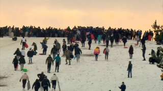 Crowds sledging on Cow Hill on Newcastle Town Moor