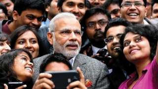 Prime Minister Narendra Modi takes a selfie with Indian employees during a visit to the Airbus facility in Toulouse, France, 2015
