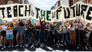Teach the Future banner at climate demo
