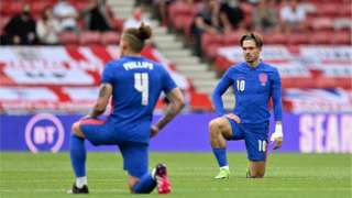 England footballers kneeling before game