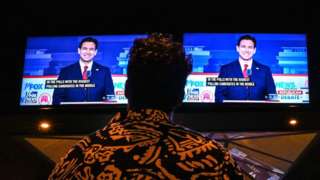 A member of the Atlanta Young Republicans attends a watch party of the first Republican Presidential primary debate at a bar in Atlanta, Georgia on August 23