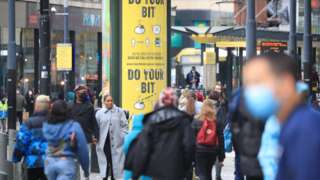 A social distancing advice sign in Manchester city centre