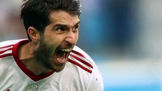 Karim Ansarifard celebrates a World Cup goal for Iran