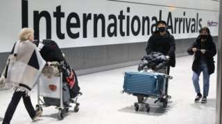 Passengers arrive at Heathrow Airport in London after the last British Airways flight from China touched down in the UK on Wednesday 29 January, 2020.