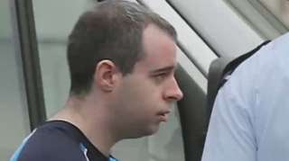 Eric Eoin Marques with police