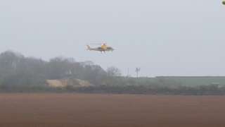 Air ambulance over quarry