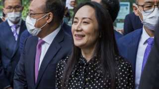 Meng Wanzhou (C) leaves British Columbia Supreme Court and speaks to the media in Vancouver, British Columbia, Canada 24 September 2021.