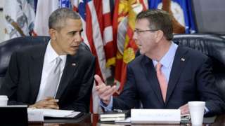 Obama and Carter speaking at an event