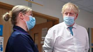 Boris Johnson speaking to a senior nurse at a hospital in Colchester