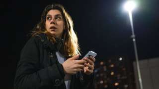 Woman holding a phone