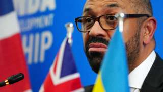 Home Secretary James Cleverly at a press conference in the Rwandan capital Kigali on 5 December 2023