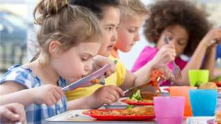Children eating a school meal