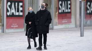 Women wearing masks on street