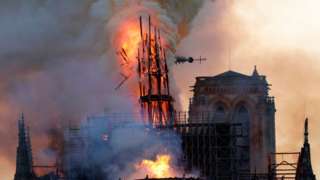 Notre Dame spire on fire in April 2019