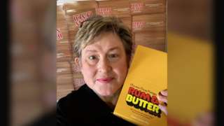A photo of Crystal Regehr Westergard with a box of Rum & Butter
