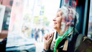 An older woman on a bus
