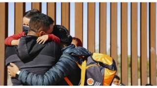 Family hugs at the US-Mexico border. File photo