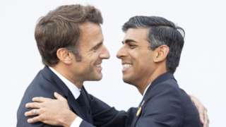 Macron hugs Sunak