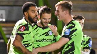 Forest Green Rovers players celebrate their opening goal against Scarborough Athletic in the FA Cup
