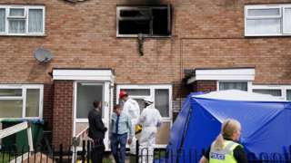 Officers at a property on Tame Road in Tipton, West Midlands