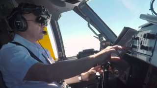 A pilot using the ClearView technology to land