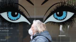 Woman in mask in Hamilton