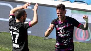 Emiliano Buendia and Xavi Quintilla celebrate a goal against QPR