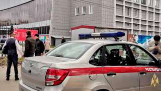 A car of Russia's National Guard is seen at the scene after a gunman opened fire at the Perm State University in Perm, Russia, on 20 September 2021