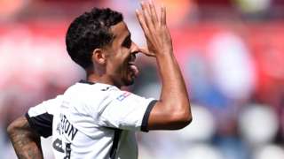 Kyle Naughton celebrates his goal