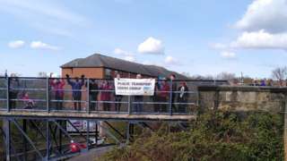 Campaigners on footbridge