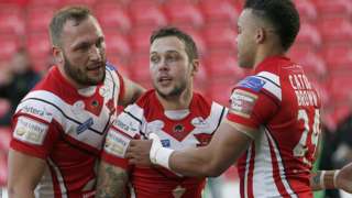 Gareth O'Brien (centre) celebrates the Salford's first try against Castleford