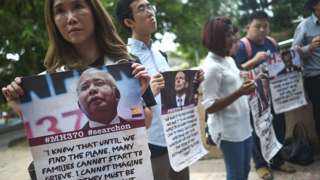 Victims' relatives and their supporters protest against the suspension of the search