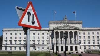 Road sign in front of stormont