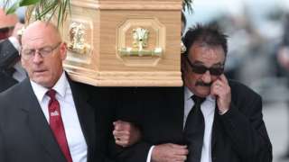 Paul Elliott carries the coffin of his brother Barry